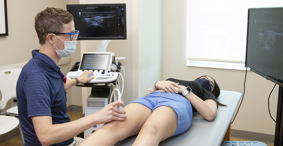 Dr. Jones doing an ultrasound on a patient in clinic