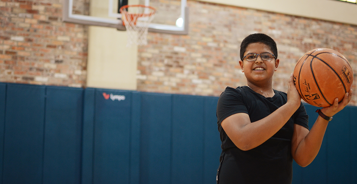 young athlete playing basketball