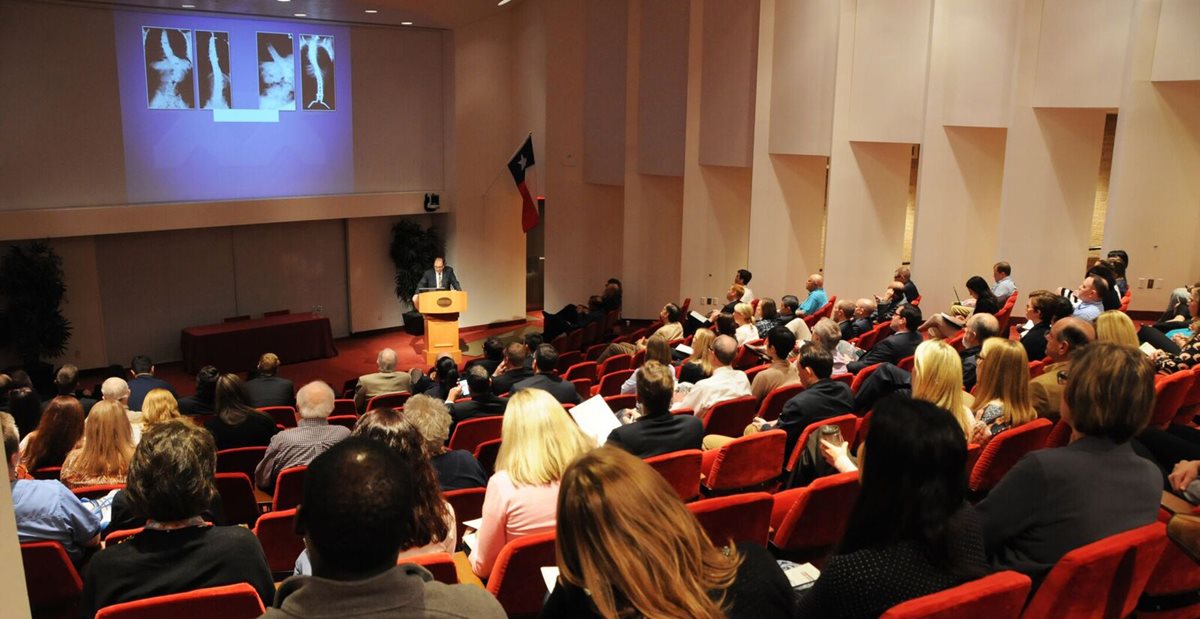 Texas Scottish Rite Hospital for Children doctor lecturing on patient care, education and research