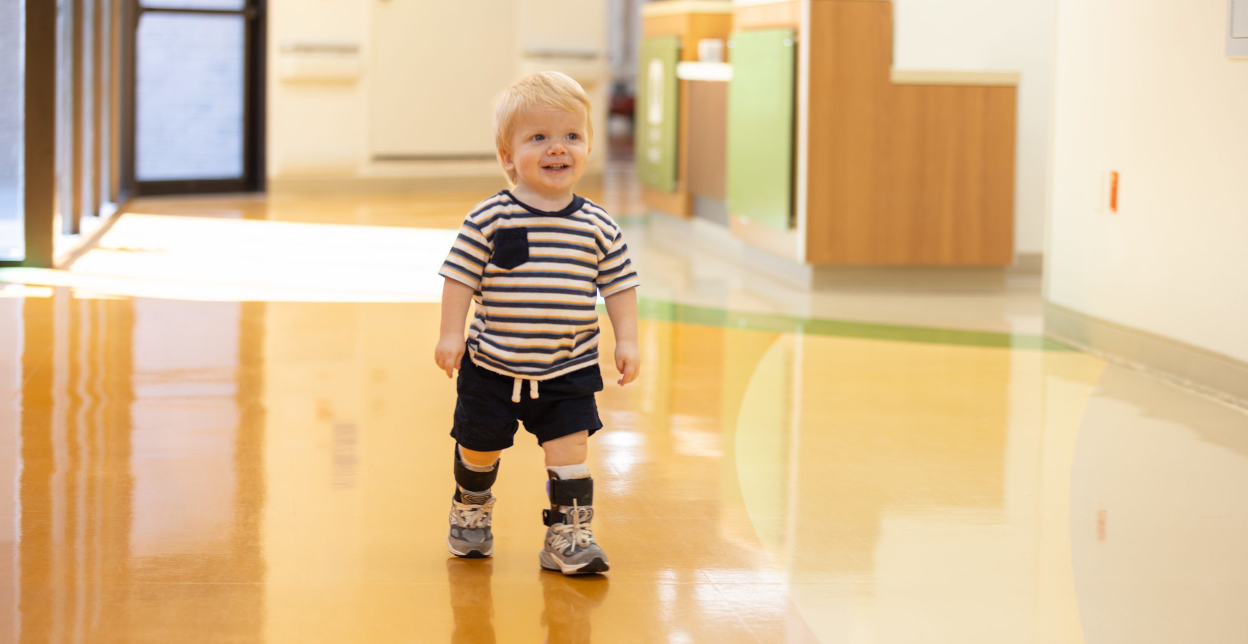 Child walking in clinic halls.